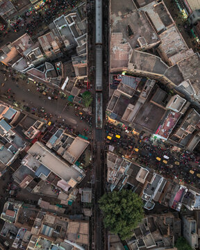Aerial view of bustling Kote Gate market with crowded streets and vibrant buildings, Bikaner, India.