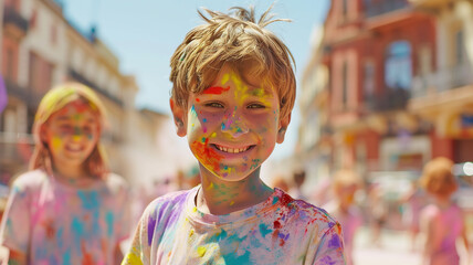 This Children engage joyfully in Holi festivities, covered in colorful powders under a bright sun.