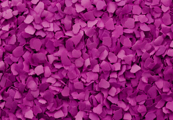 Fototapeta premium A vibrant pink glitter texture background with shimmering particles, perfect for adding a festive and sparkling touch to designs. The bright purple undertones bring energy and excitement, making it id