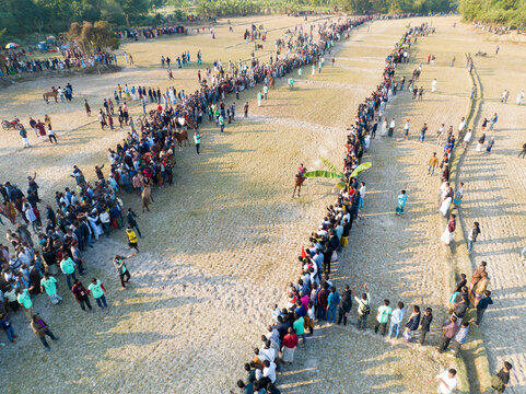Ghatail, Bangladesh - 28 December 2024: Aerial view of a vibrant gathering in a field with a crowd of people celebrating a festival, Rasulpur Union, Ghatail, Bangladesh.