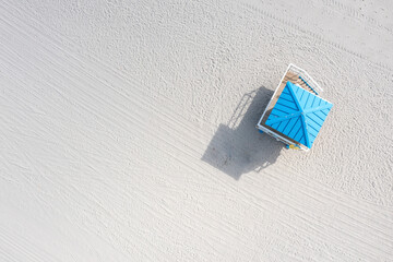 Aerial view of a lifeguard hut on a serene beach with sand and blue sea, Hollywood, United States.