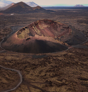 Aerial view of volcanic calderas and rugged terrain, Volcan El Cuervo, Lanzarote, Spain.