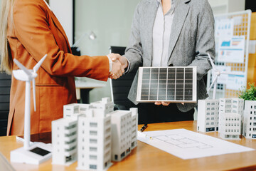 Business team people planning hand using laptop for working technology and business Net zero and...