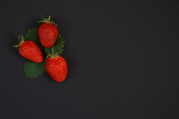 Strawberries on a black background.