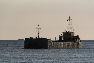 Obraz premium DUMP BARGE ON THE WATERWAY - Ship sails through the sea