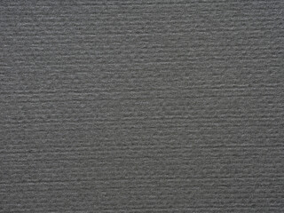 Fototapeta premium Layered shades of gray mimic the quiet rhythm of a stone-washed sea under a winter sky