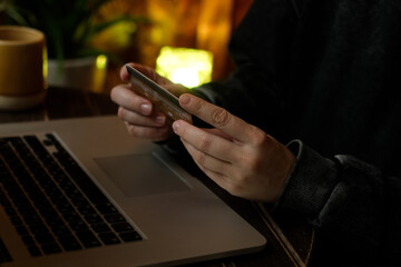 Paying online. Woman using laptop for e-commerce transactions and managing payments via bank card. 