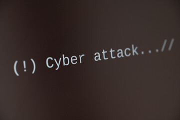 Black computer screen, with text cyber attack. and computer system block.
