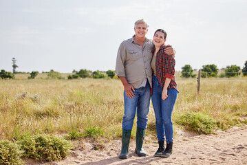 Family, portrait and woman with senior dad, farm and hug for countryside, holiday and happy together. Daughter, mature man and father for vacation, bonding and love in rural field environment © Nina Lawrenson/peopleimages.com