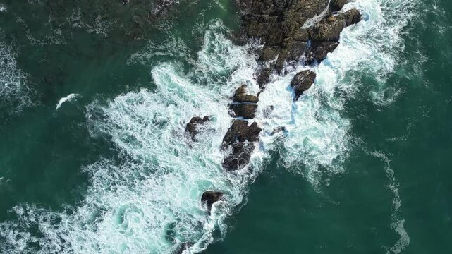 A view from the dorna of the waves breaking on the rocks. Turquoise color. Tangalle, Sri Lanka