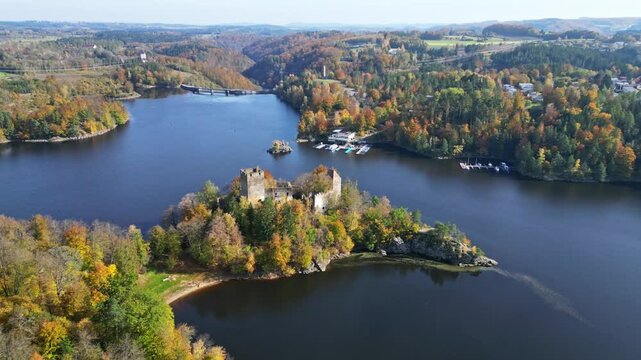 Aerial view of Stausee Ottenstein with a beautiful castle ruin surrounded by autumn trees, Zwettl, Austria.