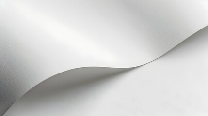 Smooth, flowing white paper sheet creating elegant curves against a soft backdrop, ideal for backgrounds