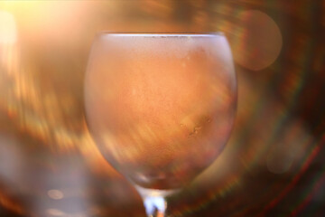 A glass of white wine on a blurred abstract background, alcohol, relaxation