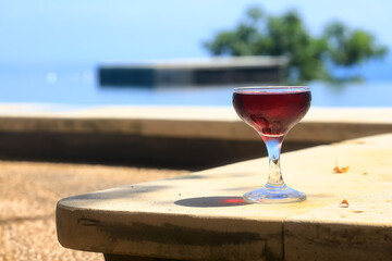 A glass of red wine is a beautiful background for serving