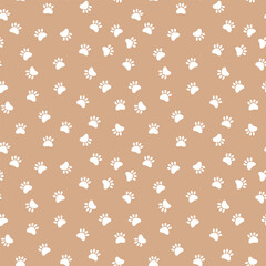 Seamless Paw Print Background. Seamless pattern with white pet paw prints on a pastel pink background