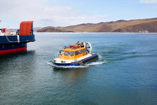 A hovercraft transports tourists across Lake Baikal to Olkhon Island in the spring.