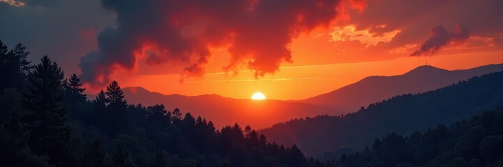 Orange glow illuminates darkening sky with fiery haze, flames, inferno, forest