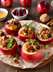 Baked apples with granola, cranberries, nuts and honey