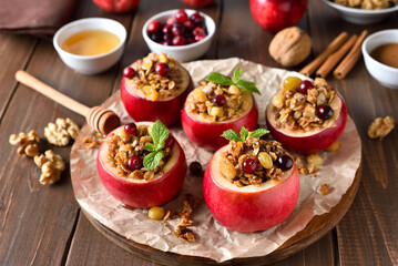 Baked apples with granola, cranberries, nuts and honey