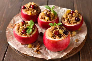 Baked apples with granola, cranberries, nuts and honey