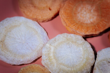 A macro shot of freeze-dried slices showcasing their deep, colorful hues, crunchy texture, and intricate patterns. Great for food, nutrition, and healthy snack themes.