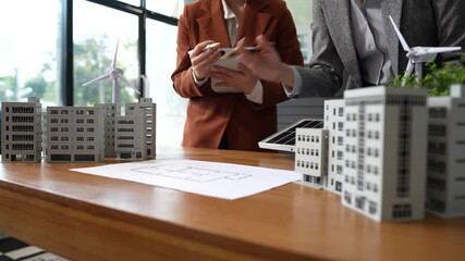 Businessmen shake hands after agreeing to start a new project successfully, renewable and sustainable development, and solar panel concept. - Powered by Adobe