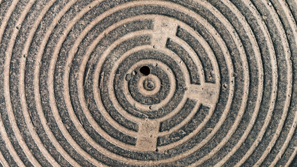 Fototapeta premium concentric round texture cast-iron hatch cover of brown rusty co