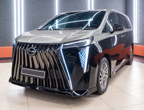  Gac Master M8 two-color premium luxury car in showroom. Black Chinese minivan , VAN trumpchi M8. Front view, side view. Exterior minivan Gac Master M8.