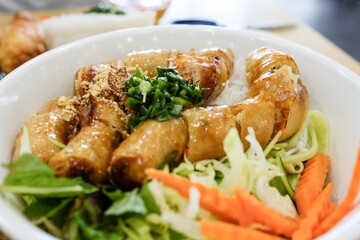 Close-up of a bowl of Southern-style bun cha (combination vermicelli noodle bowl with spring rolls) at Phu Quoc, a Vietnamese restaurant in Cabramatta, Sydney — New South Wales