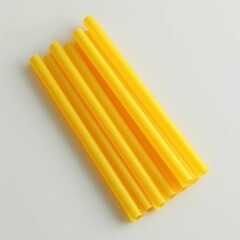 Colorful yellow plastic drinking straws.