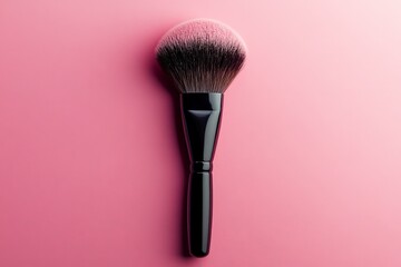 Makeup brush on a pink background highlighting cosmetic tools for beauty routines