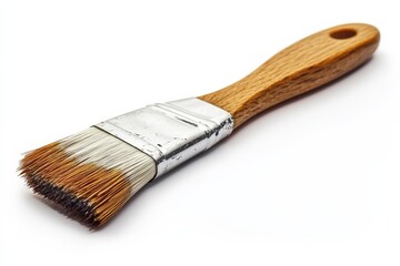 Detailed paint brush resting on a white background ready for creative projects in art and home...