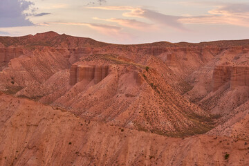 Badlands at sunset in the Gorafe Desert, Los Coloraos, Granada Geopark. Spain