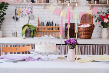 Interior of kitchen with table served for Easter celebration