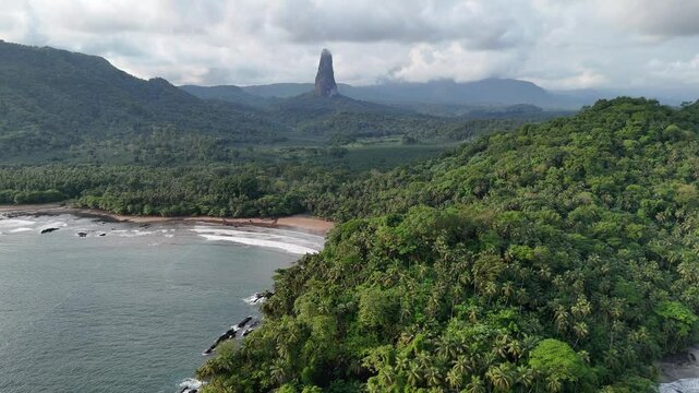 Sao Tome and Principe - Aerial View of Pico Cao Grande. Iconic Volcanic Needle Rising Above Lush Tropical Rainforest. View From Praia Grande. 