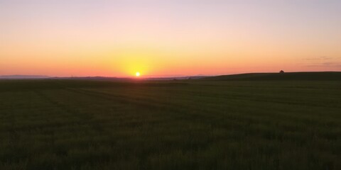 Fototapeta premium Vibrant and soothing gradient of hues as the sun sets over the horizon, sky, nature, evening