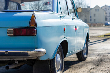 Old blue Russian classic vintage car in the street