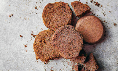 Top view of coffee grounds from espresso machine. coffee ground on gray background