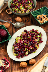 Healthy salad - boiled beetroot with pomegranate.