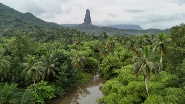 Sao Tome and Principe - Aerial View of Pico Cao Grande. Iconic Volcanic Needle Rising Above Lush Tropical Rainforest. View From Praia Grande.