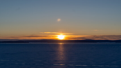 Golden Sunrise Over Ice
A captivating golden sunrise over the frozen Khuvsgul Lake in Mongolia, reflecting light off the icy surface and creating a serene atmosphere.