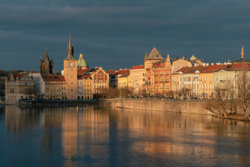Prague city at Charles bridge during sunset.