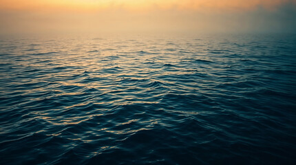 Obraz premium Golden sunset reflecting on gently moving water surface