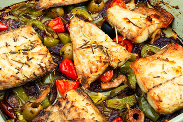 Fish fillet and baked vegetables.