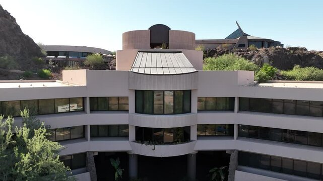 Aerial view of marriott phoenix resort tempe at the buttes with modern architecture and surrounding desert landscape, tempe, united states.