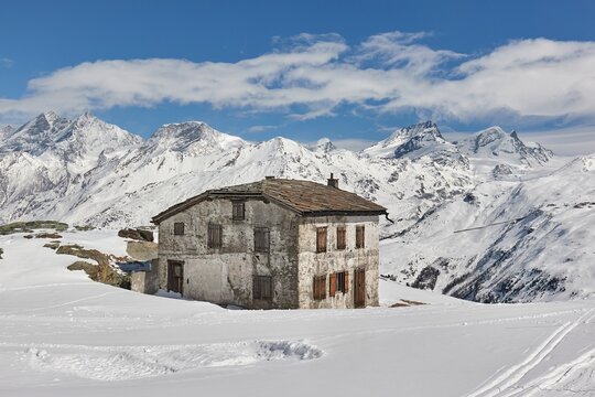 Old house in snowy high mountains
