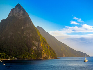 sailing cruise ship of Windstar Cruises, in the background the volcanoes Gros Piton and Petit...