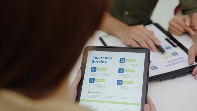 Asian financial consultant explaining investment insurance to  couple using a laptop at home.financial planning for future goals.