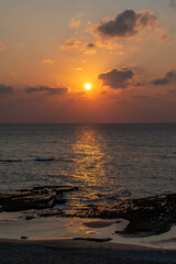 Orange sunset at a far north beach near Lebanon on the Mediterranean Sea.
