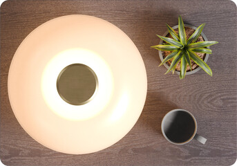 Perspective view of wooden bedside table with lamp shade